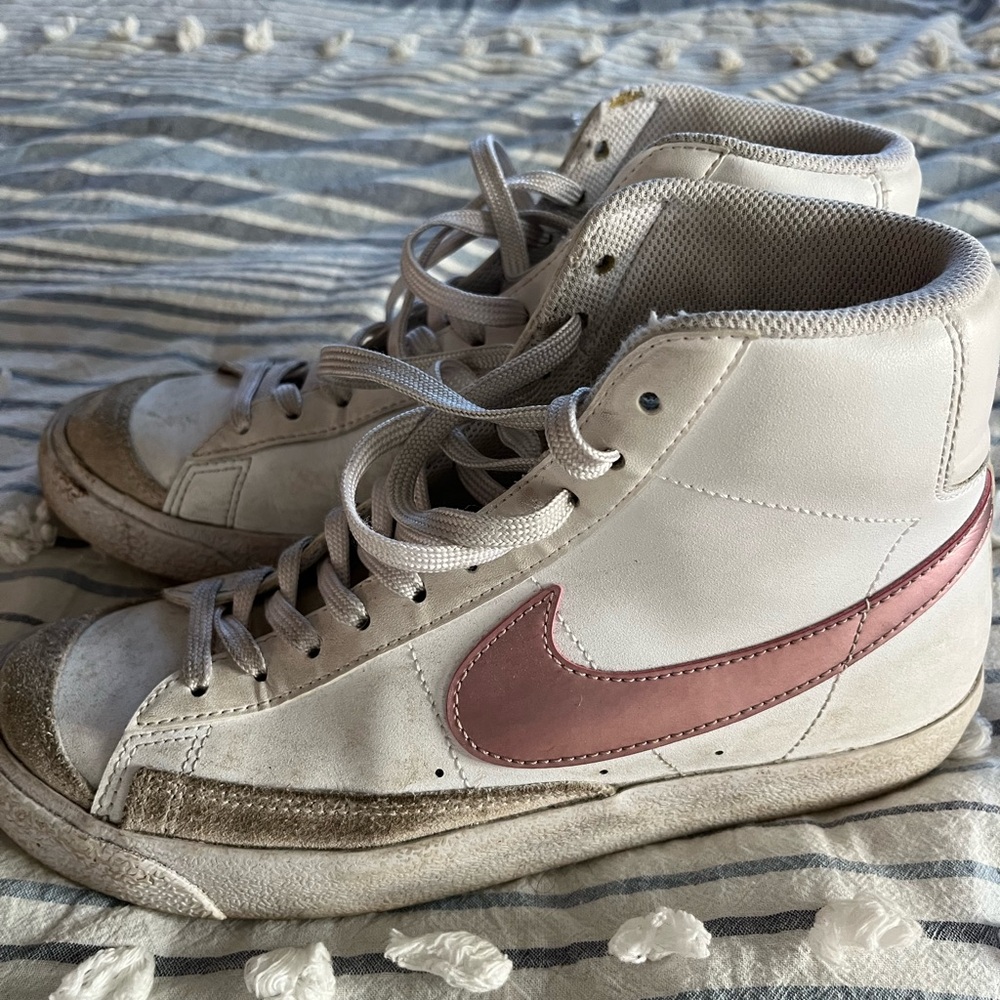 Women’s Nike high top Blazerrs with pink stripe.
